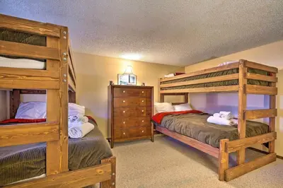 a bedroom with two bunk beds and a dresser at Ian's Camelback House in Tannersville