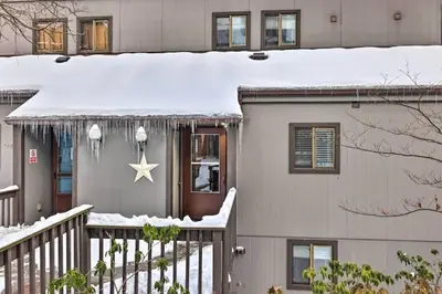 a house covered in snow with a star on it at Ian's Camelback House in Tannersville