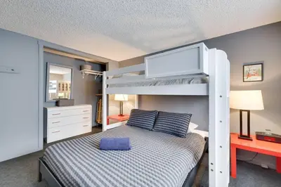 a bedroom with a bunk bed with a tv on it at Garrett's Camelback House in Tannersville
