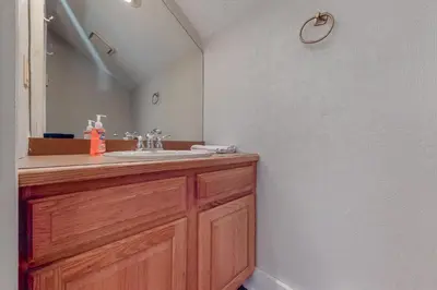 a bathroom with a sink and a mirror at Unwind in Telstar in Lake Harmony