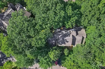 an overhead view of a house in the trees at Unwind in Telstar in Lake Harmony