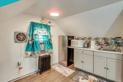 a kitchen with a sink and a counter top at 11 Mi to Manhattan Pet-Friendly Duplex with Yard! in Teaneck