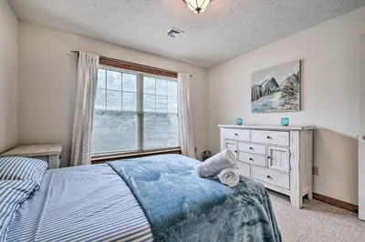 a bedroom with a bed and a dresser and a window at Tannersville Townhome, Near Camelback Mtn! in Tannersville