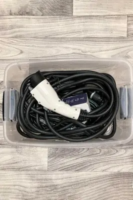 a charger in a plastic container on a floor at Tannersville Townhome, Near Camelback Mtn! in Tannersville