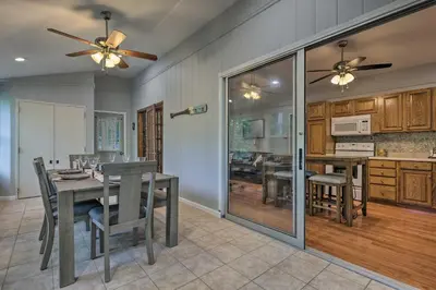 a dining room and kitchen with a table and chairs at 22 Mi to Ski Big Bear! Lake Wallenpaupack Getaway in Greentown