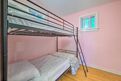 a bedroom with two bunk beds and a window at 22 Mi to Ski Big Bear! Lake Wallenpaupack Getaway in Greentown