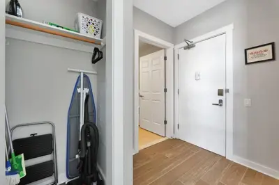 a room with a hallway with a door and a room with a hallway at Elegant Main Street Living* Near NYC in Hackensack