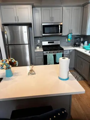 a kitchen with a counter with a roll of paper towels at SPRINGVIEW HOMES 12MINS FROM EWR & 3 MINS FROM UNIVERSITY HOSPITAL in Newark