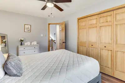 a bedroom with a large bed and a ceiling fan at Hot Tub Soaks! Family Home 6 Mi to Big Boulder Mtn in Albrightsville