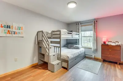 a bedroom with a bunk bed and a staircase at Hot Tub Soaks! Family Home 6 Mi to Big Boulder Mtn in Albrightsville