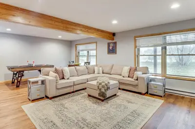 a living room with a couch and a table at Hot Tub Soaks! Family Home 6 Mi to Big Boulder Mtn in Albrightsville