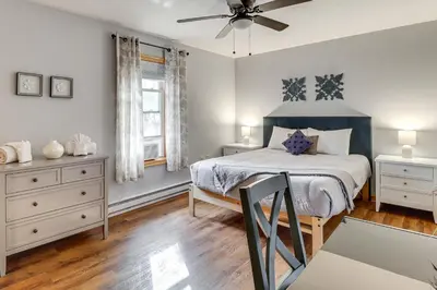 a bedroom with a bed and a ceiling fan at Hot Tub Soaks! Family Home 6 Mi to Big Boulder Mtn in Albrightsville