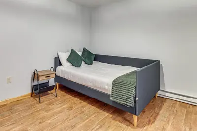 a bed with green pillows in a room at Hot Tub Soaks! Family Home 6 Mi to Big Boulder Mtn in Albrightsville
