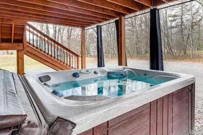 a jacuzzi tub in a house with a deck at Hot Tub Soaks! Family Home 6 Mi to Big Boulder Mtn in Albrightsville