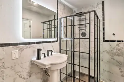 a bathroom with a sink and a shower at Chic Long Pond Family Home with Fire Pits and Deck! in Long Pond