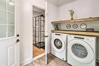 a laundry room with a washer and dryer at Chic Long Pond Family Home with Fire Pits and Deck! in Long Pond