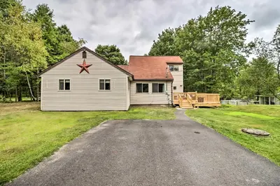 a large white house with a driveway at Chic Long Pond Family Home with Fire Pits and Deck! in Long Pond