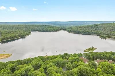 an aerial view of a river with trees at Big Boulder Lake Townhome in Lake Harmony