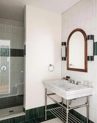 a bathroom with a sink and a shower at The Quoin Hotel in Wilmington