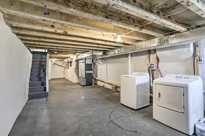 an empty room with two refrigerators in a building at Philadelphia Townhome Less Than 8 Mi to Center City! in Philadelphia