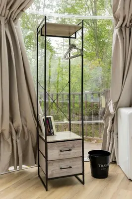 a black and white dresser in front of a window at Serene 3-Bedroom Home with Dome, Hot Tub, Sauna in Hurleyville