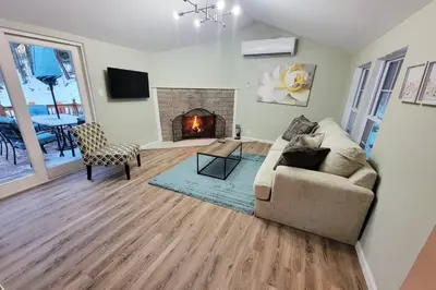 a living room with a couch and a fireplace at Serene 3-Bedroom Home with Dome, Hot Tub, Sauna in Hurleyville