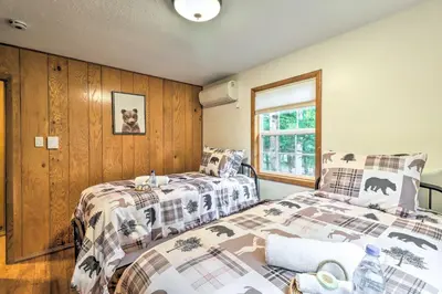 a bedroom with two beds and a window at Walk to Wolf Run Lake Cottage with Furnished Deck in Albrightsville