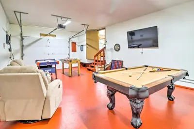 a living room with a pool table and a tv at Walk to Wolf Run Lake Cottage with Furnished Deck in Albrightsville