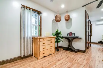 a room with a dresser and a window at Pet-Friendly Delta Cabin with Private Hot Tub! in Delta