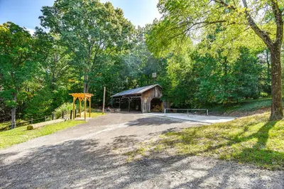 a pavilion in the middle of a park with trees at Pet-Friendly Delta Cabin with Private Hot Tub! in Delta