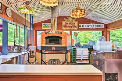 an inside view of a food truck with a stove at Handcrafted Log Cabin in Candor Group Getaway! in Candor