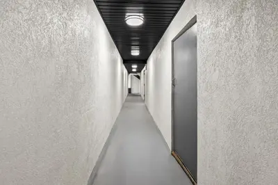 a hallway with a corridorngthngthngthngth at Red Carpet Inn and Suites in Bellmawr