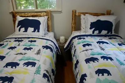 a bedroom with two beds with bears on them at Escape to a 3-Bedroom Cabin in Lower Catskills in Woodridge