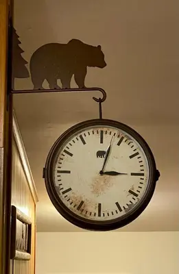 a clock with a bear on top of it at Escape to a 3-Bedroom Cabin in Lower Catskills in Woodridge