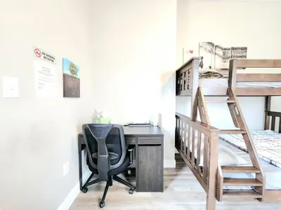 a desk with a chair next to a bunk bed at Great Studio Apartment by Universities in Philadelphia