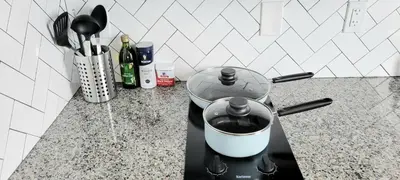 a pot on a stove in a kitchen at Great Studio Apartment by Universities in Philadelphia