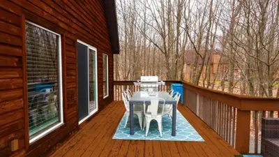 a screened in porch with a table and chairs on it at March Giveaway: 3 Nights equal $50 Activity Credit in Albrightsville