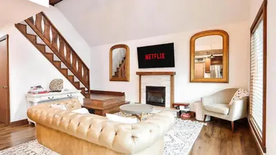 a living room with a couch and a fireplace at March Giveaway: 3 Nights equal $50 Activity Credit in Albrightsville