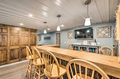 a large room with a large wooden table and chairs at Deck and Game Room Home in Pennsylvania Countryside in Klingerstown