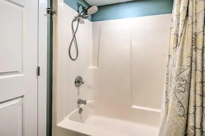 a bathroom with a shower with a tub at Deck and Game Room Home in Pennsylvania Countryside in Klingerstown