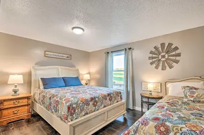 a bedroom with two beds and a window at Deck and Game Room Home in Pennsylvania Countryside in Klingerstown