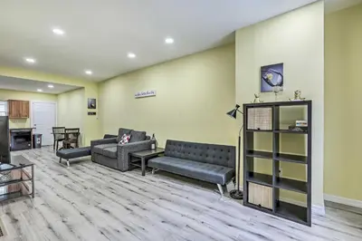 a living room with two couches and a kitchen at Philly Townhome with Gas Grill about 5 Mi to Dtwn! in Philadelphia