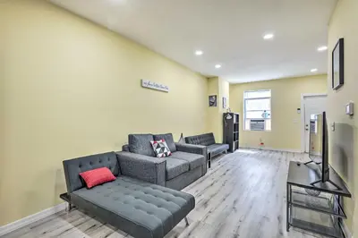 a living room with two couches and a tv at Philly Townhome with Gas Grill about 5 Mi to Dtwn! in Philadelphia
