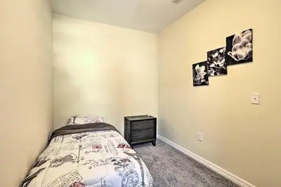 a bedroom with a bed and a dresser in it at Philly Townhome with Gas Grill about 5 Mi to Dtwn! in Philadelphia