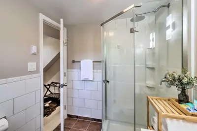 a bathroom with a shower with a glass door at Game Room, Community Beach Pocono Home! in Albrightsville