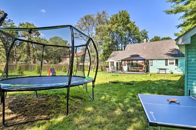 a trampoline in the yard of a house at Game Room, Community Beach Pocono Home! in Albrightsville