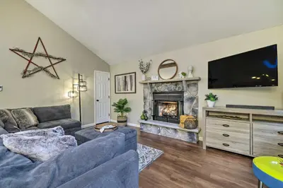a living room with a couch and a fireplace at Charming Albrightsville Home with Gas Fire Pit! in Albrightsville
