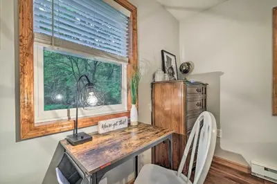 a home office with a desk and a window at Charming Albrightsville Home with Gas Fire Pit! in Albrightsville