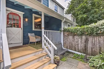 a front porch of a blue house with a white door at Charming Lambertville Retreat - 1 Mi to River! in Lambertville