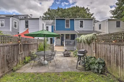 a patio with a table and an umbrella at Charming Lambertville Retreat - 1 Mi to River! in Lambertville
